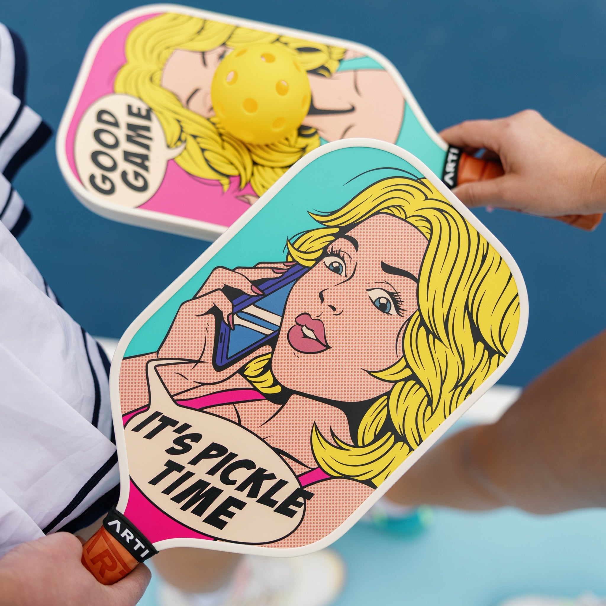 ARTI It's Pickle Time K&K pop-art pickleball paddle held courtside